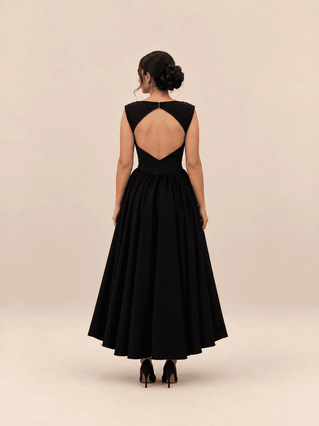 Noir flare dress — open back view